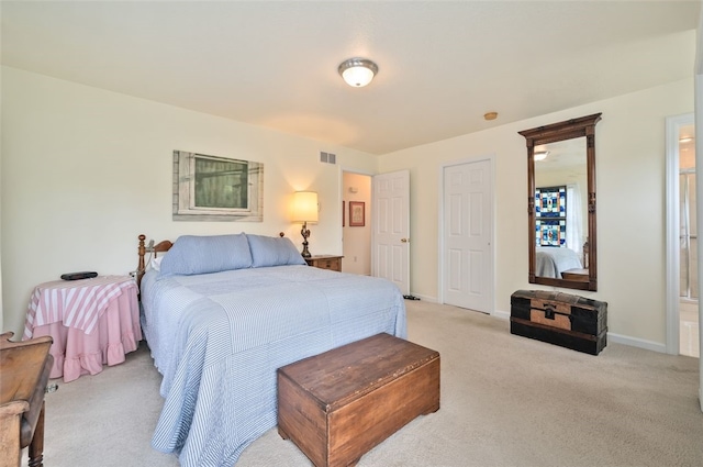 bedroom featuring light colored carpet, visible vents, and baseboards