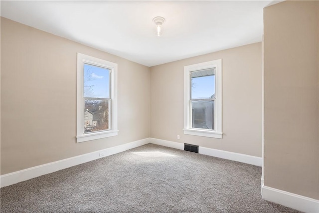 spare room with carpet flooring