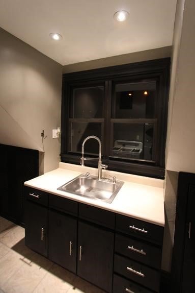 interior space featuring sink and light tile patterned floors