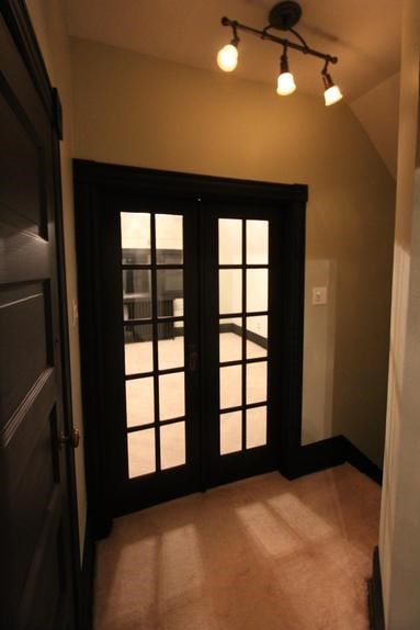 entryway with french doors and vaulted ceiling