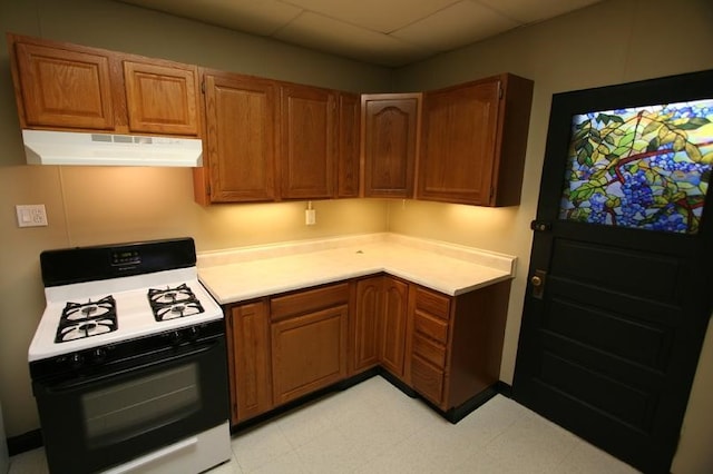 kitchen with white gas stove