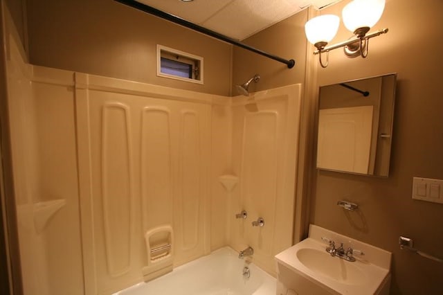 bathroom featuring sink and bathtub / shower combination