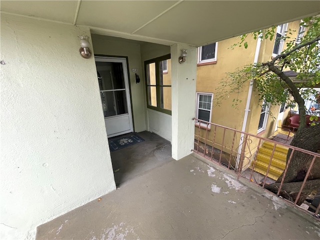 entrance to property featuring a patio area