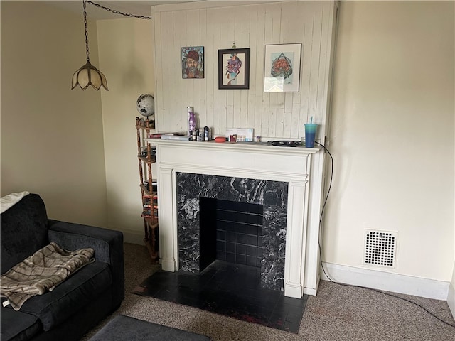 carpeted living room with a fireplace