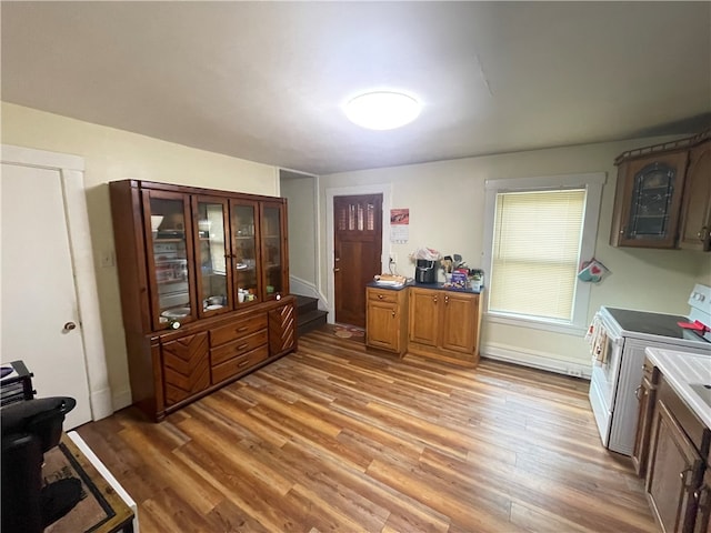 kitchen featuring washer / clothes dryer and hardwood / wood-style flooring