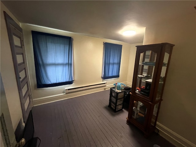 interior space with dark hardwood / wood-style flooring and a baseboard radiator