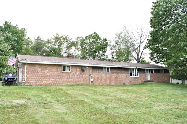 back of house with a yard