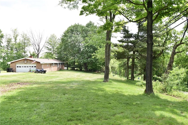 view of yard featuring a garage