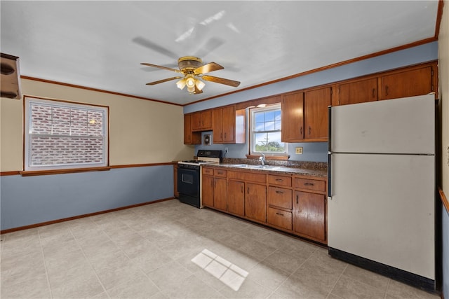 kitchen featuring light tile patterned flooring, ceiling fan, sink, fridge, and stove