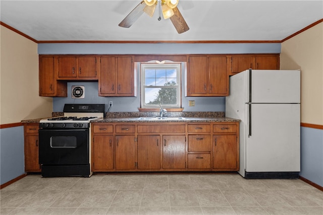 kitchen with white appliances, sink, crown molding, light tile patterned flooring, and ceiling fan