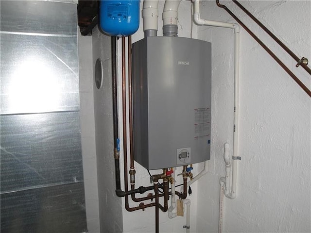 utility room with water heater