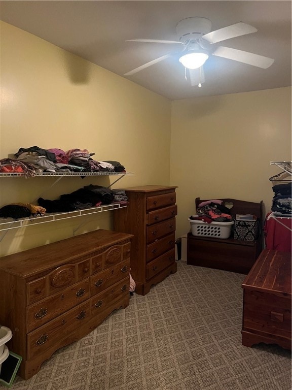 bedroom with ceiling fan and carpet flooring