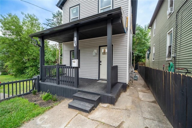 property entrance featuring covered porch