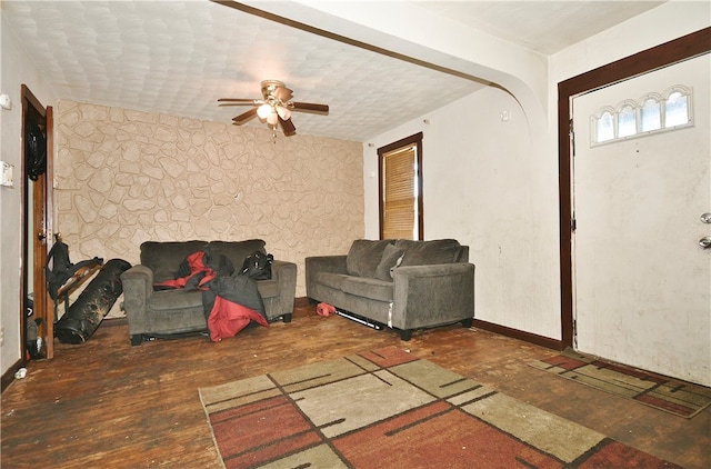 living room featuring ceiling fan and hardwood / wood-style floors