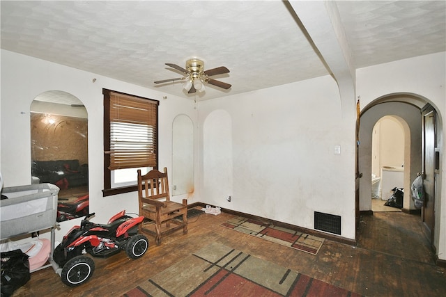 interior space featuring ceiling fan