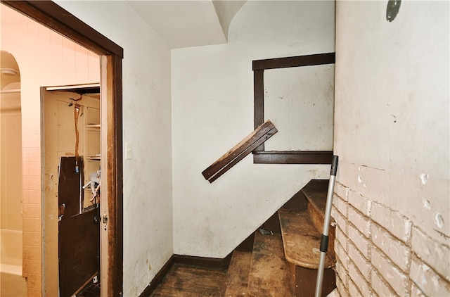 stairway with hardwood / wood-style floors