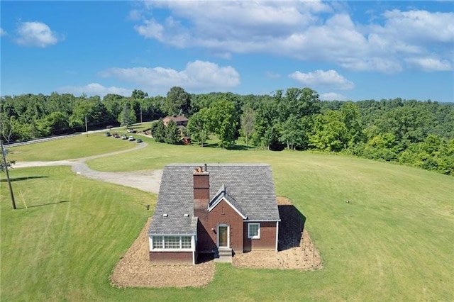 view of home's community with a lawn