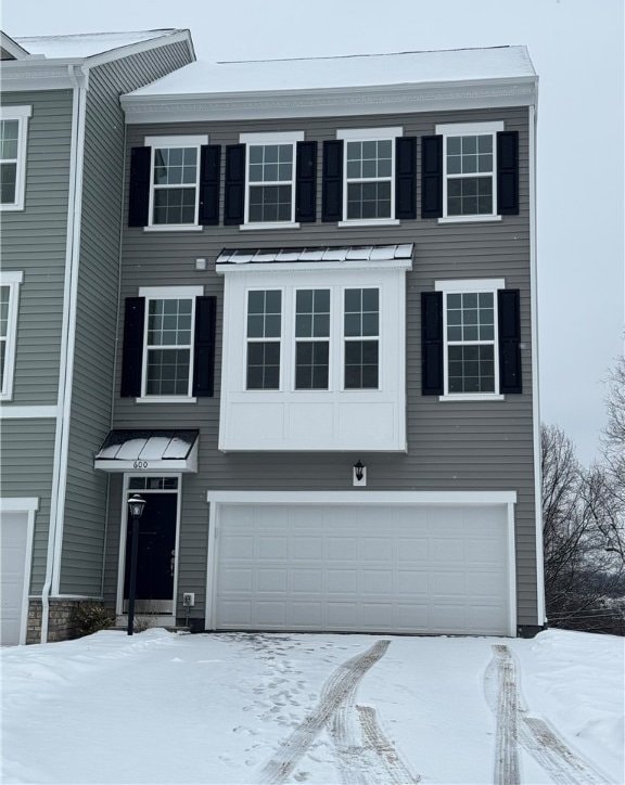 view of front of home with a garage