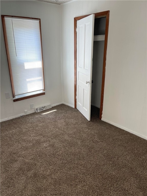 unfurnished bedroom with carpet