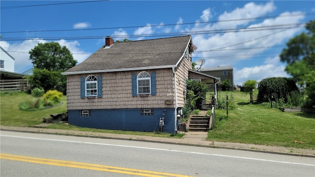 view of property exterior with a lawn