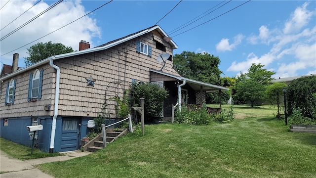 view of property exterior with a lawn