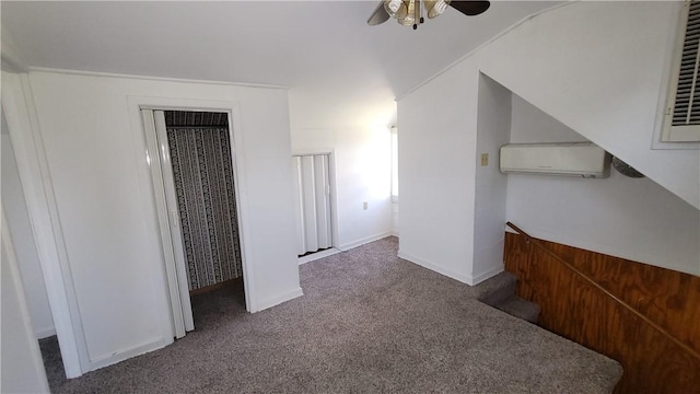 interior space with carpet and an AC wall unit