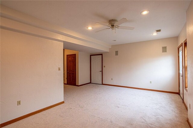 carpeted empty room featuring ceiling fan