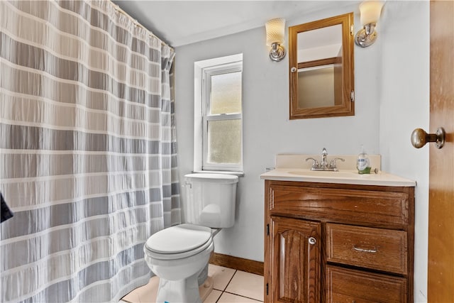 bathroom with tile patterned flooring, vanity, and toilet