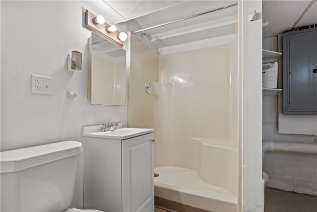 bathroom with a shower, a textured ceiling, vanity, electric panel, and toilet