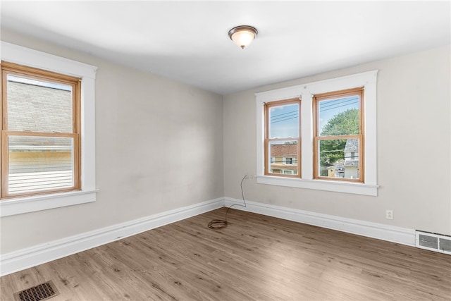 unfurnished room featuring wood-type flooring