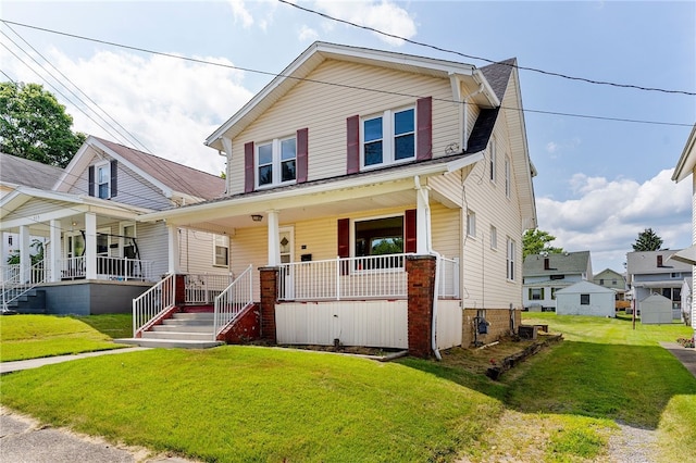 view of front of home featuring covered porch and a front yard