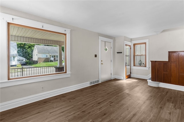 foyer entrance with dark hardwood / wood-style flooring