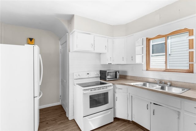 kitchen featuring white cabinetry, light wood-type flooring, white appliances, and sink