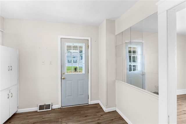 doorway with hardwood / wood-style floors