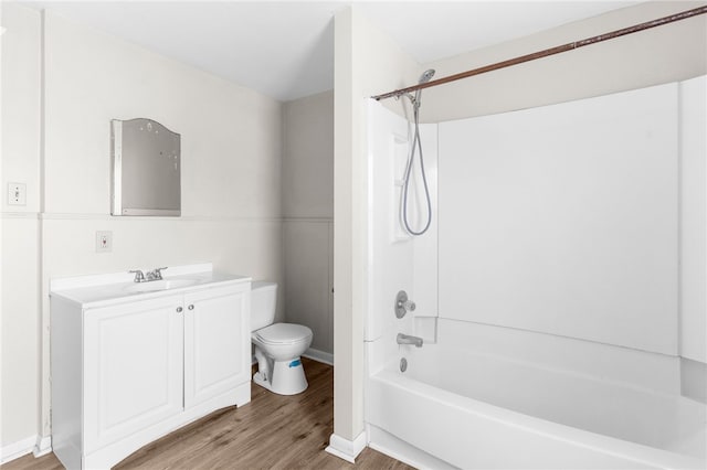 full bathroom featuring vanity, bathtub / shower combination, wood-type flooring, and toilet