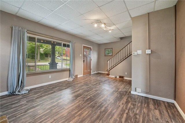 foyer featuring a paneled ceiling, hardwood / wood-style flooring, and rail lighting