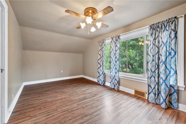 bonus room featuring lofted ceiling, hardwood / wood-style floors, and ceiling fan