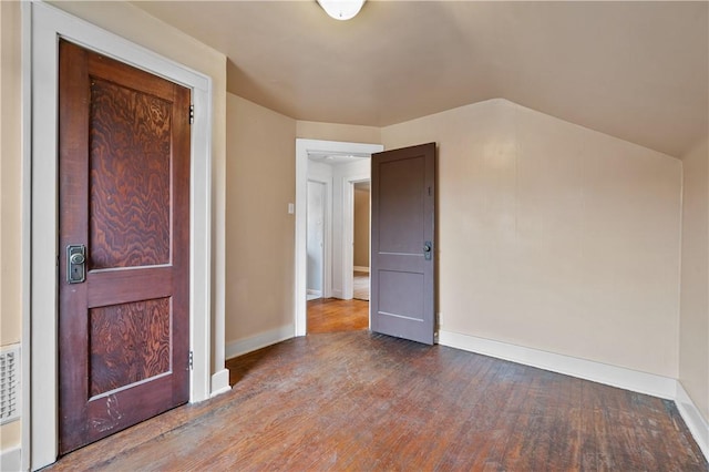 interior space featuring wood-type flooring and lofted ceiling