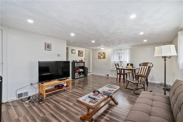 living room with dark wood-type flooring