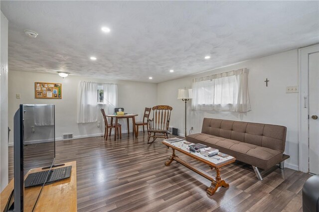 living room with dark wood-type flooring