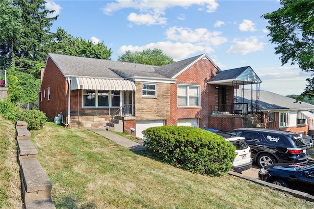 view of front of home with a garage and a front yard