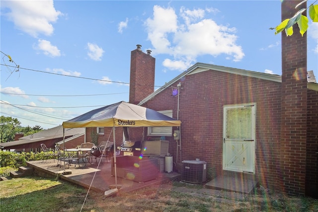 back of house with a patio and central AC unit