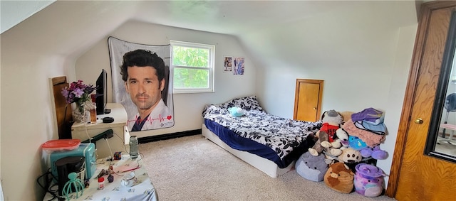 carpeted bedroom featuring vaulted ceiling