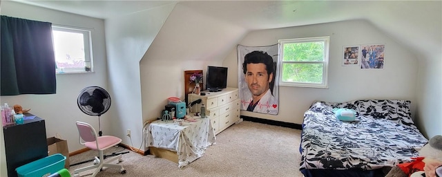 bedroom featuring light colored carpet and lofted ceiling