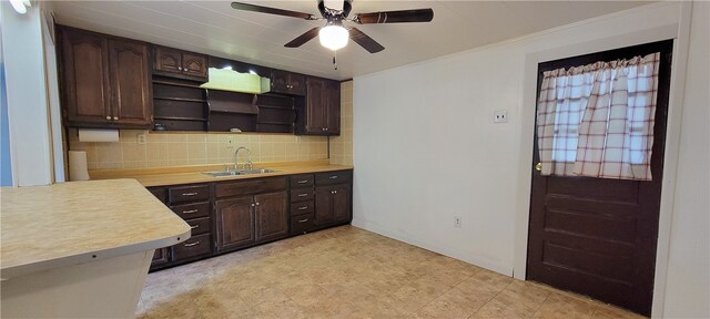 kitchen with tasteful backsplash, sink, dark brown cabinetry, light tile patterned flooring, and ceiling fan