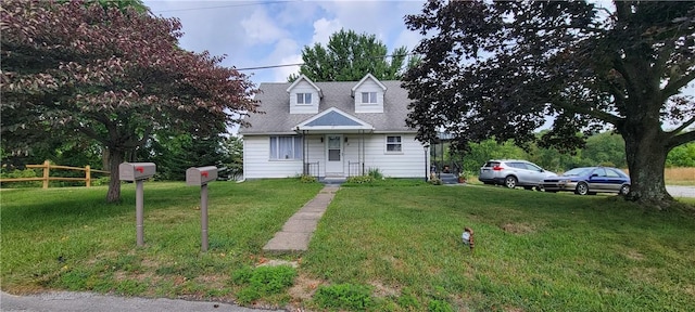 cape cod house featuring a front lawn