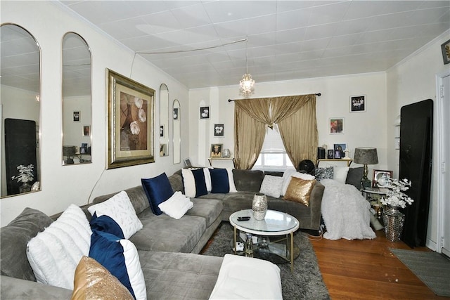 living room with hardwood / wood-style flooring and ornamental molding