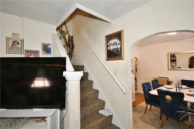 staircase with ornamental molding