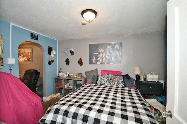 carpeted bedroom featuring a textured ceiling