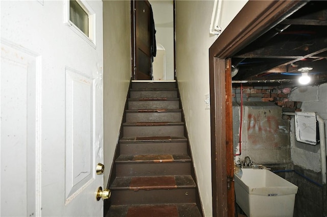 staircase featuring sink